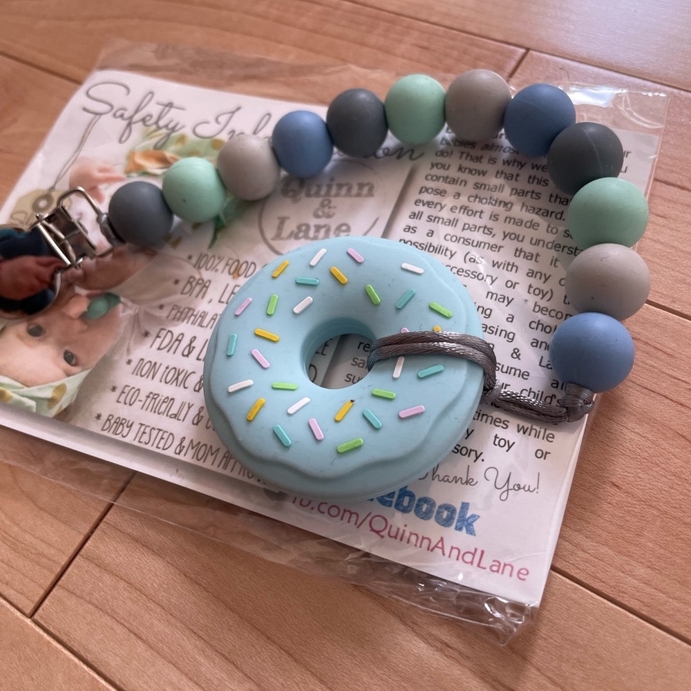 Silicone pacifier clip with chewable ice blue donut toy